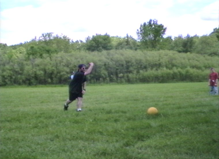 Plyc031.jpg - Geoff Horst playing with campers at the athletic field.