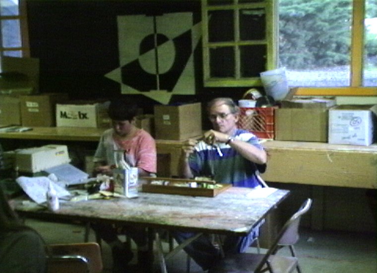 Plyc034.jpg - First session. Another one of my campers in the Craft Shop. Joshua Couper and fishing specialist Dr. Bob Obma.