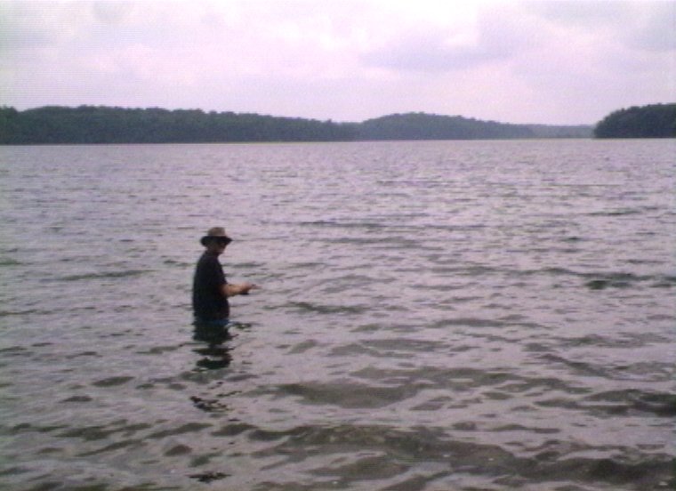 Plyc239.jpg - Canoe trip in the Sylvania Wilderness in Michigan. ”Mountain” Mike Rule is trying to catch some dinner.
